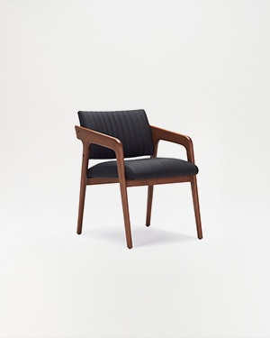 The Aux Armchair redefines comfort with its plush cushioning and sleek ashwood frame.AUX ARMCHAIR