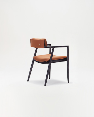 Enriched by wood accents, the design adds a unique aesthetic to spaces.DAZZLE ARMCHAIR