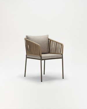 Metal and hand-made rope merge, defining a chair that welcomes with style.GUEST ARMCHAIR