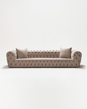 The Moon Sofa is a masterpiece of elegance, adorned with timeless capitoné detailing.MOON SOFA