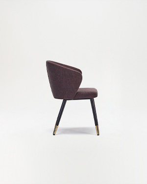 Wood details and minimalist design add an elegant touch to spaces.NOLA ARMCHAIR