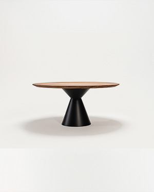 Striking and bold, the Punta Table features a metal base crowned with a solid walnut top.PUNTA TABLE