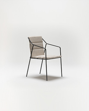 Embrace edgy aesthetics with a chair that's both robust and inviting, boasting a metal frame.REBEL ARMCHAIR