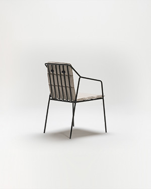 Embrace edgy aesthetics with a chair that's both robust and inviting, boasting a metal frame.REBEL ARMCHAIR