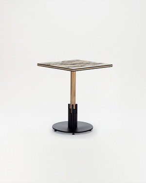 This table stands sturdy with a metal base and compact top.RONDE OUTDOOR TABLE