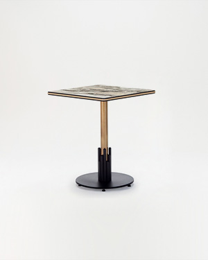 This table stands sturdy with a metal base and compact top.RONDE OUTDOOR TABLE
